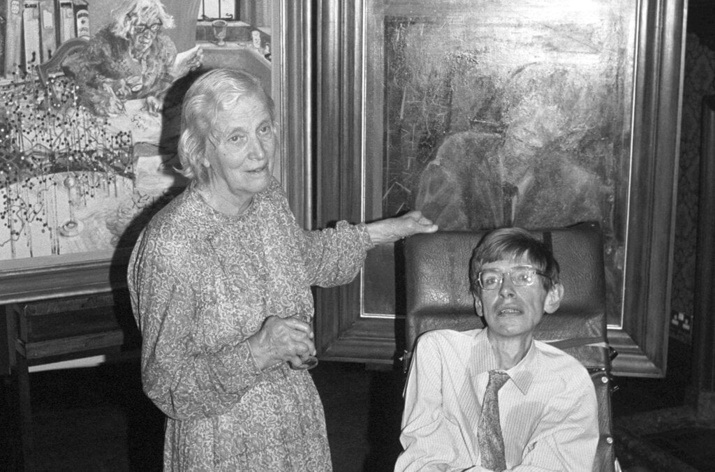 An old lady and a man in a wheelchair