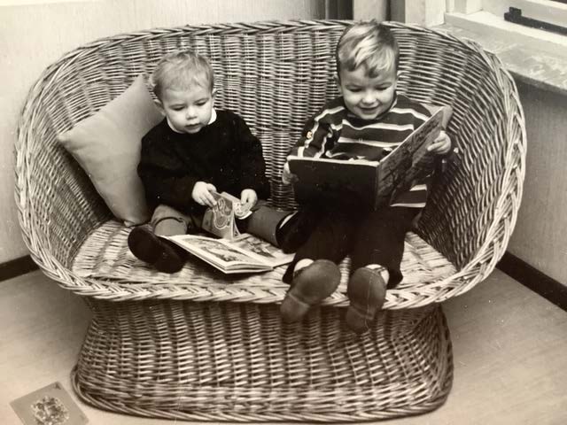 Photo of two small boys in a big chair