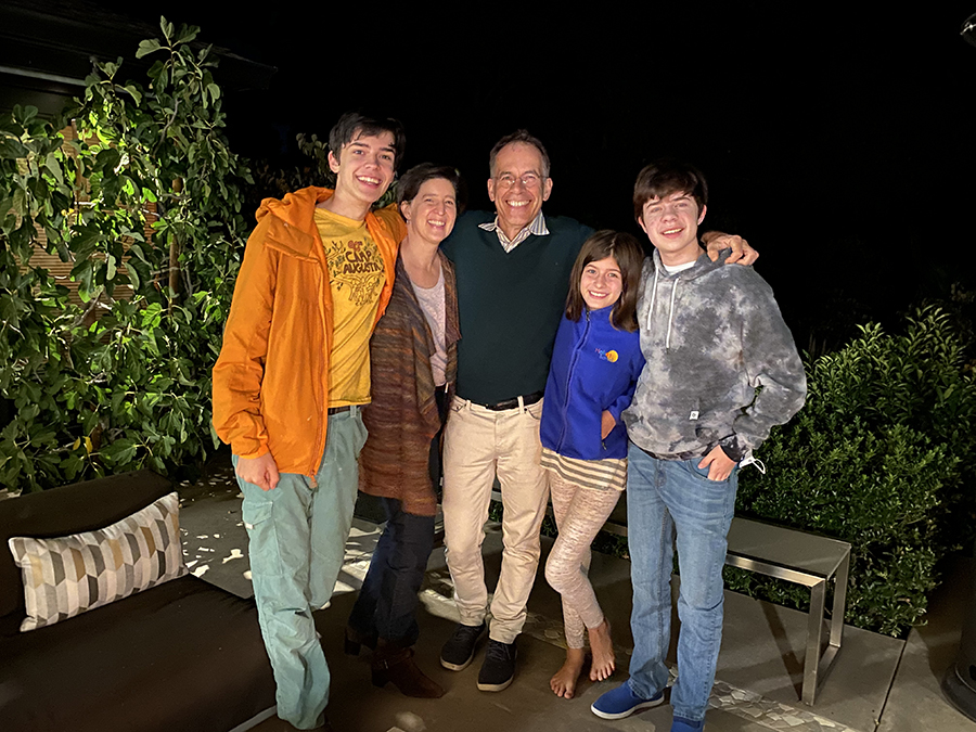 A family gathered in the backyard